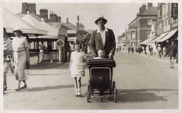 Mablethorpe, Lincolnshire - Gent pushing his young baby