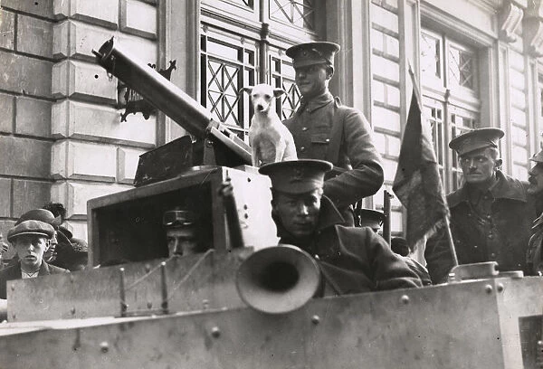 WWI: British soldiers, armoured car, terrier dog, near Antwerp