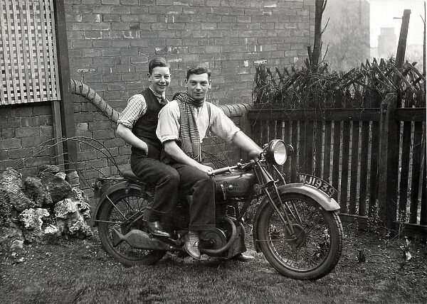Two young men on 1929 Royal Enfield motorcycle