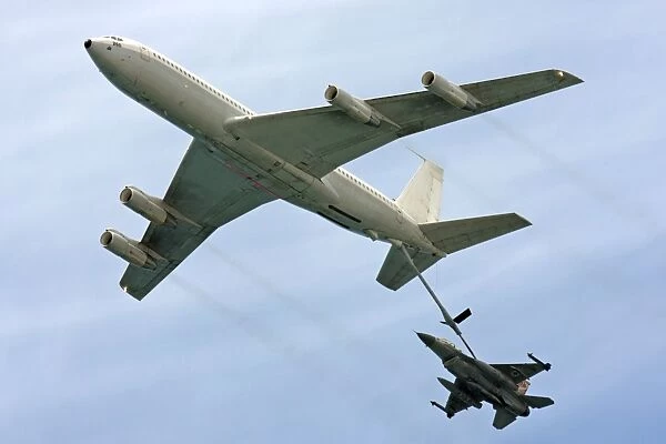 F16 jet being refueled by a Boeing 707