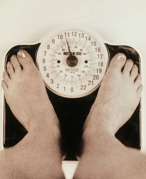 Womans feet on a set of weighing scales