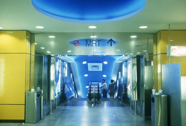 20008862. SINGAPORE Transport MRT station interior looking towards the escalators
