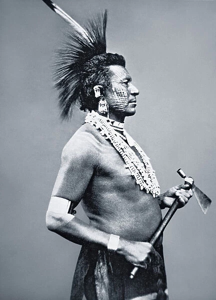 Osage Tribe Warrior with tomahawk pipe, c. 1875 (b  /  w photo)