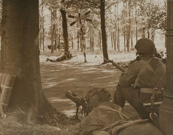 A paratrooper armed with a PIAT covers a road at Arnhem, 1944 (b  /  w photo)