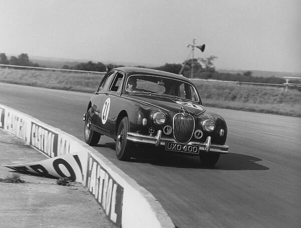 Jaguar 3. 4 Mark1 J. W. Dean at Silverstone 1961. Creator: Unknown