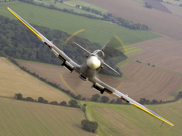 Air to air image of a Spitfire, taken over RAF Coningsby