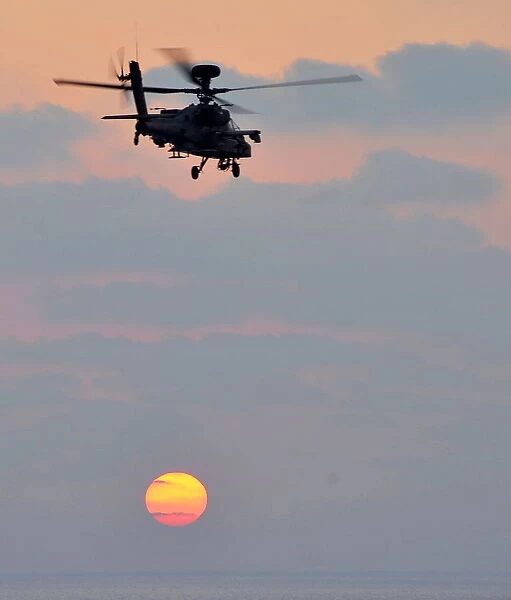 Army Air Corps Apache Helicopter Over Sunset in Mediterranean Sea