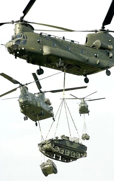 Big lift. Chinook Helicopters Lifting AFVs at RAF Lyneham