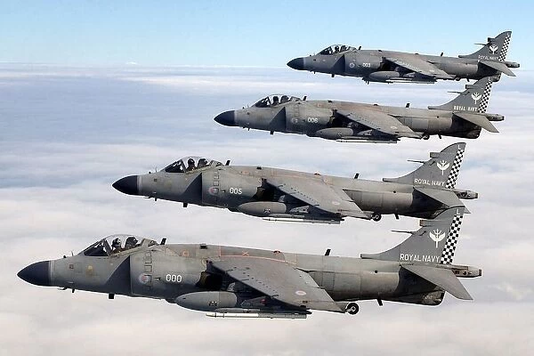 Four FA2 Sea Harriers, based at RNAS Yeovilton, flying in formation above the clouds