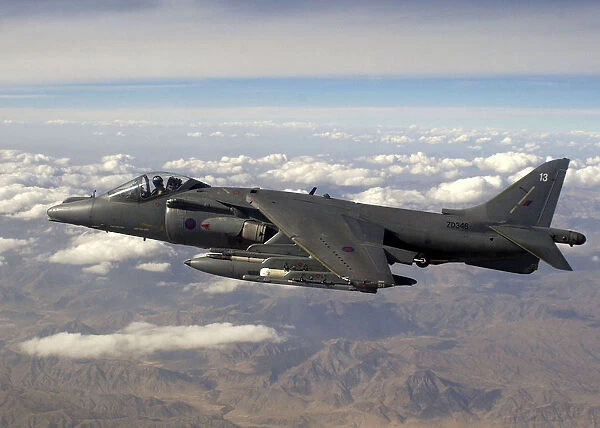 A Harrier GR7A in flight over the mountain ranges of Afghanistan during a mission