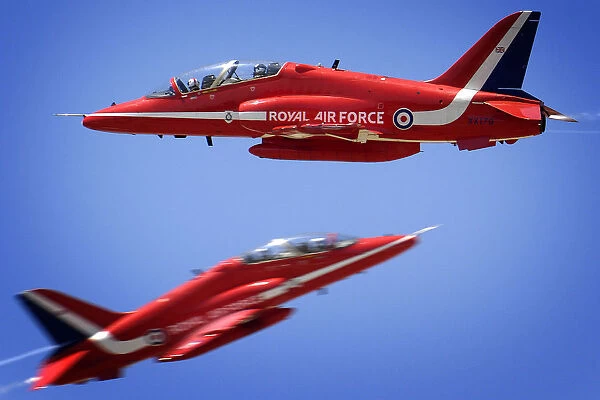 Two Hawks from the Red Arrows pass within feet of each other whilst practising the