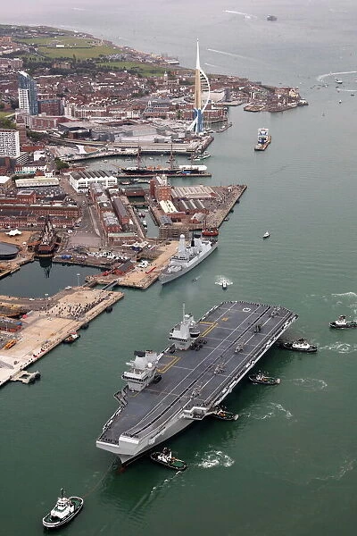 HMS Queen Elizabeth sails into her home port of Portsmouth for the first time