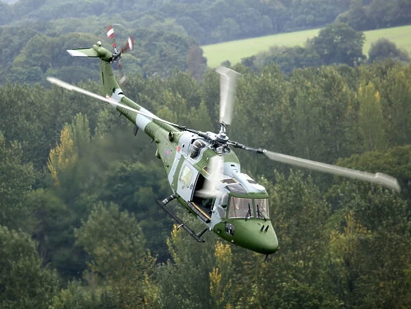 A Lynx Mk 7 of the Army Air Corps (aC) is shown flying over Bramley Training area near Basingstoke