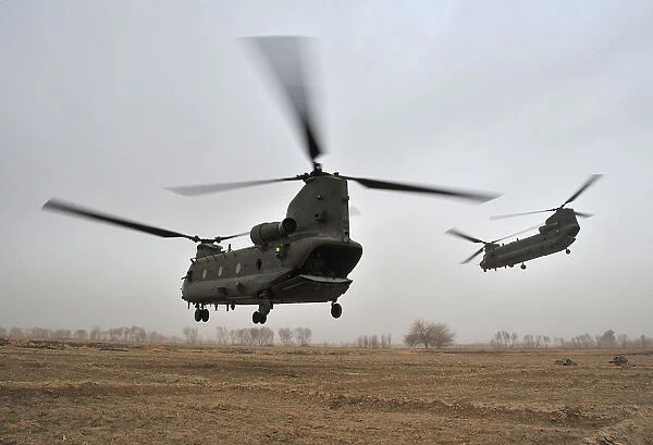 RAF Chinook Helicopters Leave a Landing in Zone in Afghanistan