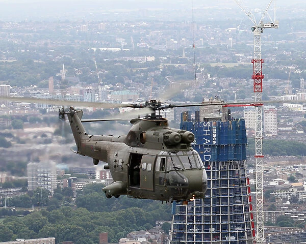 RAF Puma HC1 Helicopter Flies Past The Shard Skyscraper, London