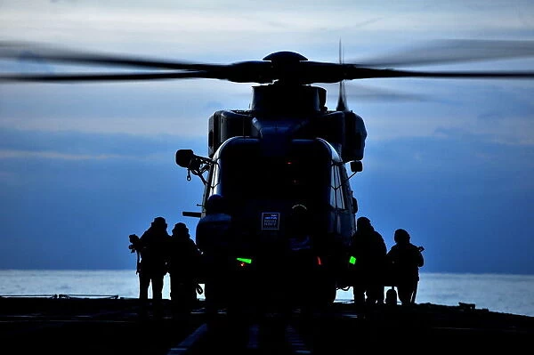 Royal Navy Merlin Helicopter Prepares to Takeoff from RFA Argus