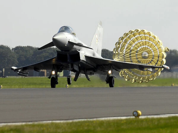 A Typhoon F2 fighter jet deploys a brake parachute as it lands at RAF Coningsby