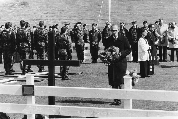 Defence Secretary John Nott placing wreath on memorial in the Falkland Islands cemetery
