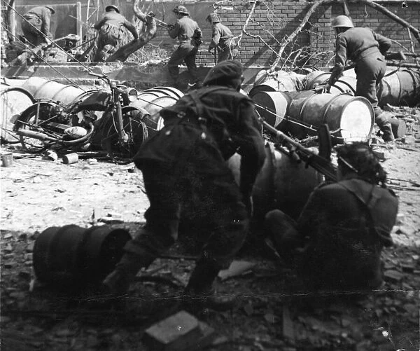 Infantry of the Royal Ulster Rifles clearing a street in Bremen. Germany