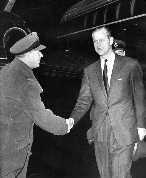 Prince Philip, Duke of Edinburgh, is welcomed to Ouston by Squadron-Leader Baker