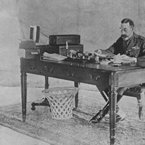 George V working in a tent