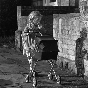 Girl with doll and pram, Balham, SW London