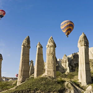 Hot Air Balloons over the Phallic pillars (Fairy Chimneys), Love Valley, near Goreme