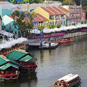 The Singapore River flows past Clarke Quay, a new area of nightlife restaurants and bars