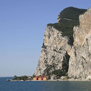 Italy, Lombardy, Lake Garda, steep cliffs fall into lake at Campione del Garda