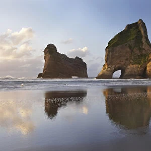 Archway Islands Reflected in Wet Sands of Wharariki Beach, near Cape Farewell, North