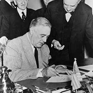 President Franklin D. Roosevelt signing the Declaration of War against Germany, December 1941