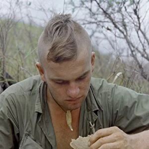 VIETNAM WAR, 1967. Specialist 4th Class Henry Greenwood eating a hot meal after Operation Cook