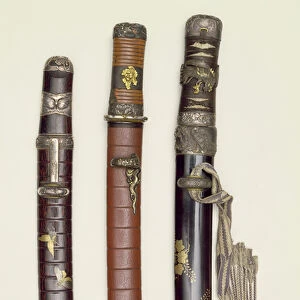 Three Aikichi Tanto swords of the Meiji period, late 19th century (wood, leather & metal)