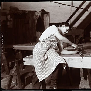 Man working in the Hardman, Peck & Co. piano factory, New York