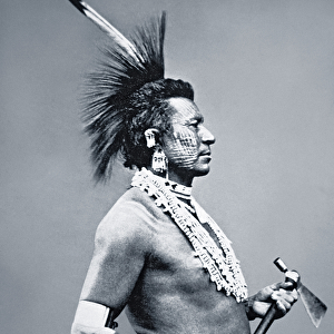 Osage Tribe Warrior with tomahawk pipe, c. 1875 (b / w photo)