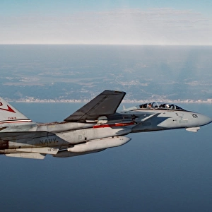An F-14A Tomcat cruises near Virginia Beach during a morning training mission