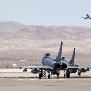 Two Royal Air Force Typhoon fighters await takeoff clearance at Nellis Air Force Base
