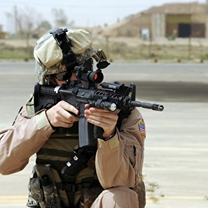U. S. Air Force Airman conducts security at an airbase in Iraq