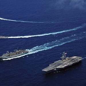 The USS Bunker Hill, the USNS Rainier, and the BAP Carvajal break away from the aircraft