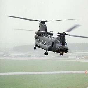 A Chinook of 27 Sqn based at RAF Odiham photographed flying low over an airfield in Scotland