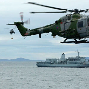HMS Ocean conducting a VERTREP with RFA Fort Austin