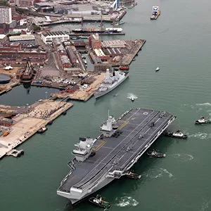 HMS Queen Elizabeth sails into her home port of Portsmouth for the first time