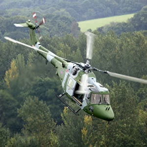 A Lynx Mk 7 of the Army Air Corps (aC) is shown flying over Bramley Training area near Basingstoke