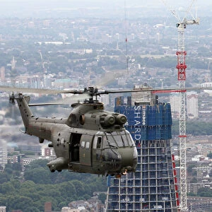 RAF Puma HC1 Helicopter Flies Past The Shard Skyscraper, London