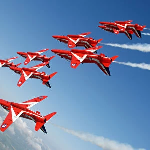The Red Arrows roll upside down in tight formation during display training