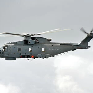 Royal Navy Merlin Helicopter Carrying a Training Torpedo