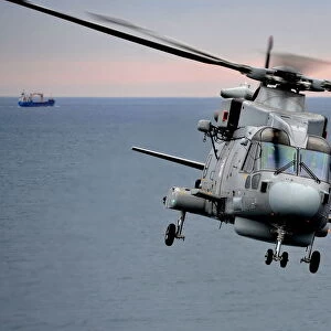 Royal Navy Merlin Helicopter Takes Off from RFA Argus