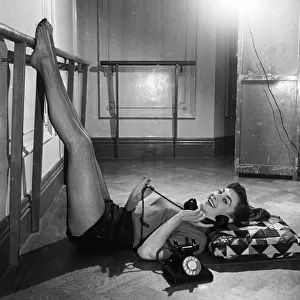 Actress Jean Marsh aged 17 posing witha telephone April 1952