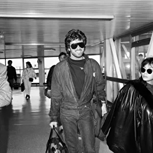 George Michael and girlfriend Kathy Jeunge, arriving at Heathrow airport from Los Angeles