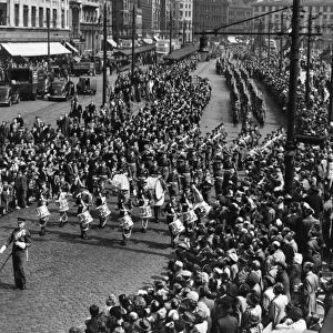 The Manchester Regiment led by the band seen here marching pass Piccadilly Gardens